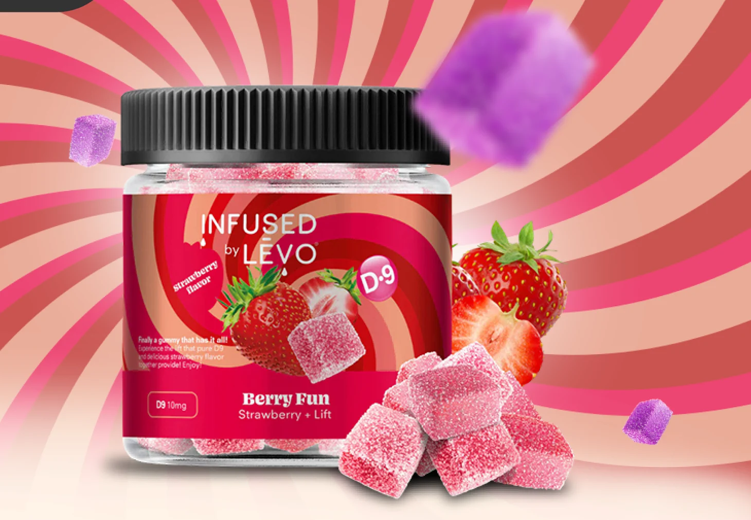 Close-up of the hero: the Berry Fun jar, strawberries and sugar-coated gummies, with out-of-focus gummy cubes floating in the foreground.